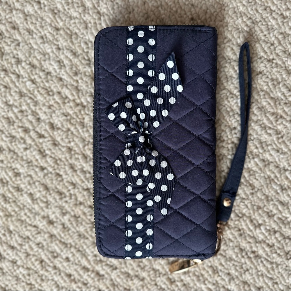 Belvay NWOT blue quilted wristlet with polka dot bow accent.